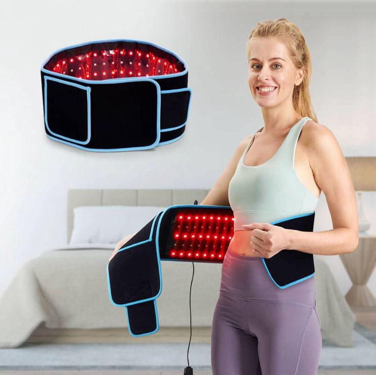 Woman wearing Glokore Red Light Therapy Wrap on lower back for pain relief